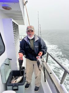 a person standing on a boat in the water